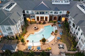 Two resort-style swimming pools with sun ledge